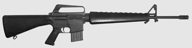 1973 Colt AR-15 SP1 rifle with 'slab side' lower receiver (lacking raised boss around magazine release button) and original Colt 20-round box magazine