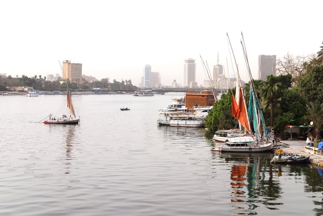 The river Nile flows through Cairo, here contrasting ancient customs of daily life with the modern city of today