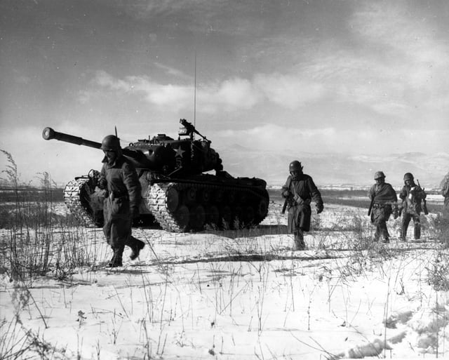 A column of the US 1st Marine Division move through Chinese lines during their breakout from the Chosin Reservoir.