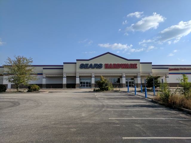 A Sears Hardware in Windham, Connecticut which closed in May 2016. Its signage logo remains intact as of 2017.