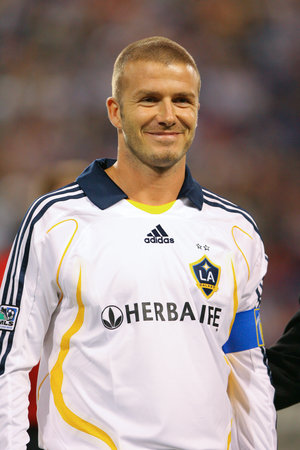 Beckham (with a blue captain's armband) became LA Galaxy captain immediately upon joining the team