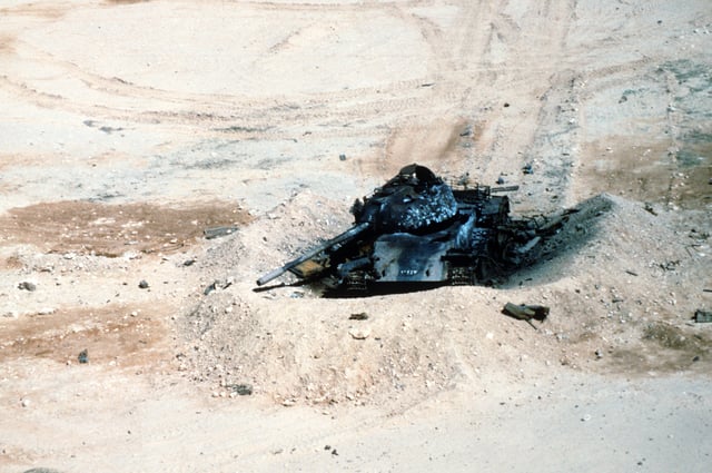 An Iraqi T-54A or Type 59 tank lies destroyed after a coalition bombing attack during Operation Desert Storm.