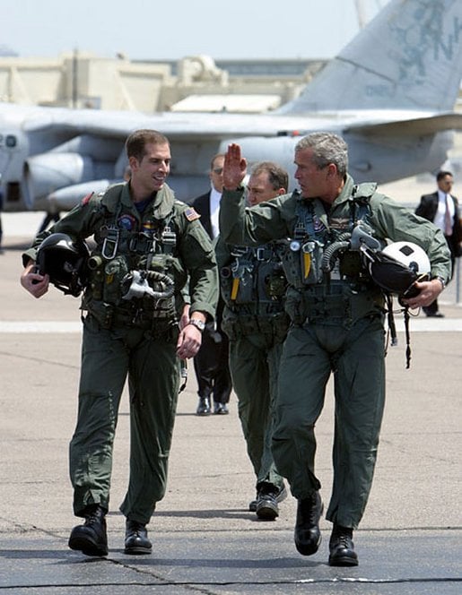 President Bush, with Naval Flight Officer Lieutenant Ryan Philips, after landing on the USS Abraham Lincoln prior to his Mission Accomplished speech, May 1, 2003