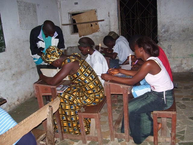 Students studying by candlelight in Bong County