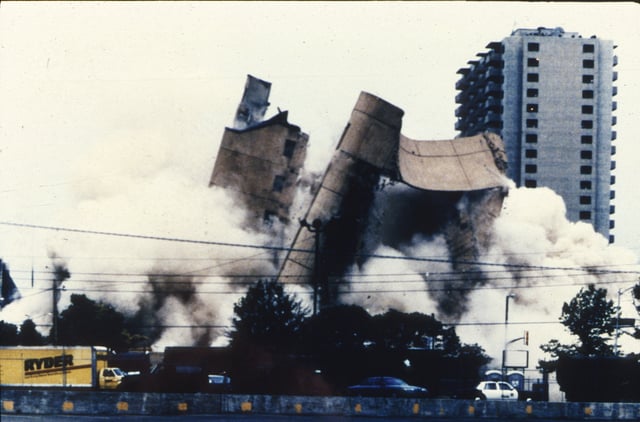 The Alfred P. Murrah Federal Building is demolished on May 23, 1995, over a month after the incident. The bomb was housed in a Ryder truck similar to the one visible in the lower left of the photograph.
