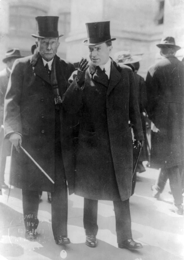 Rockefeller and his son John Jr. in 1915