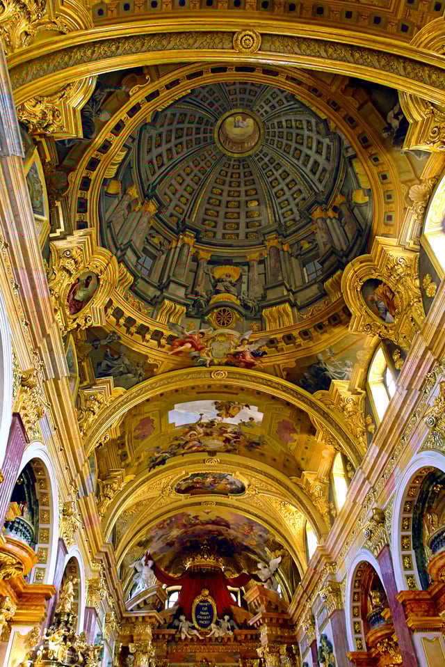 Quadratura; a painted dome by Andrea Pozzo for the Jesuit Church, Vienna, giving the illusion of looking upwards at heavenly figures around a nonexistent dome (1703)