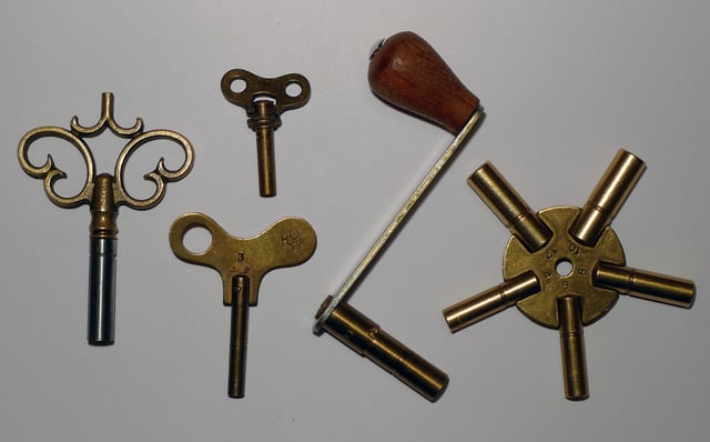 Keys of various sizes for winding up mainsprings on clocks.