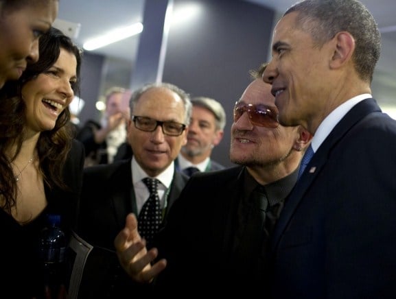 Hewson (second from left) with Barack and Michelle Obama and Bono, before a 2013 memorial service for Nelson Mandela