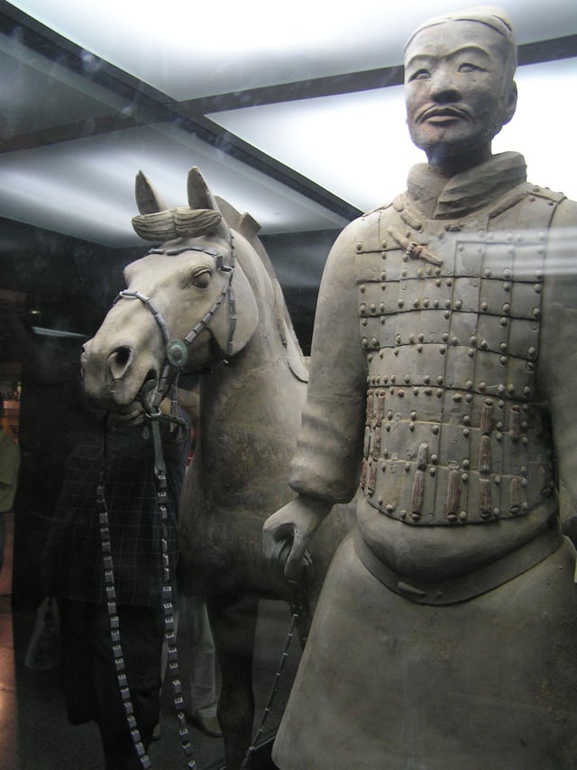 A terracotta soldier with his horse, China, 210–209 BC