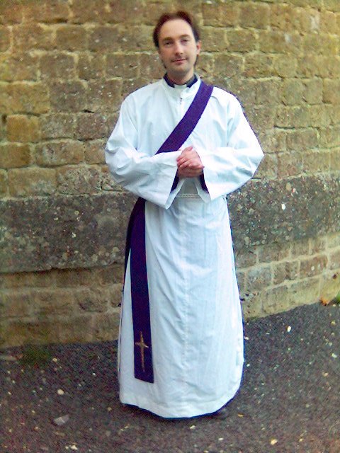 The vestments of a deacon, including a stole over the left shoulder.
