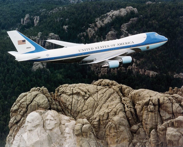Air Force One, a Boeing VC-25, over Mount Rushmore