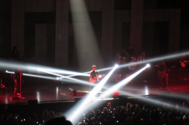 Bruno Mars and The Hooligans performing with strobe lights