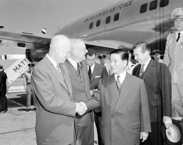 U.S. President Dwight D. Eisenhower and Secretary of State John Foster Dulles greet President Ngô Đình Diệm of South Vietnam in Washington, 8 May 1957