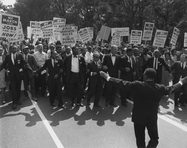 Jewish civil rights activist Joseph L. Rauh Jr. marching with Martin Luther King in 1963