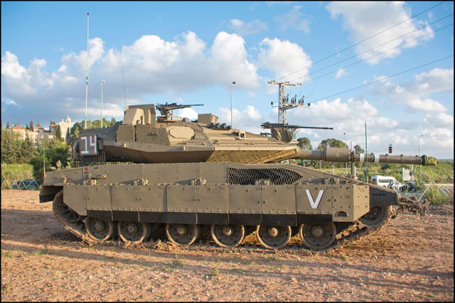 A profile of a Merkava Mk 4M tank, armed with an IMI 120 mm gun, a M2 Browning .50-cal, a 7.62x51 mm NATO commander's FN MAG, and equipped with the Trophy active protection system.