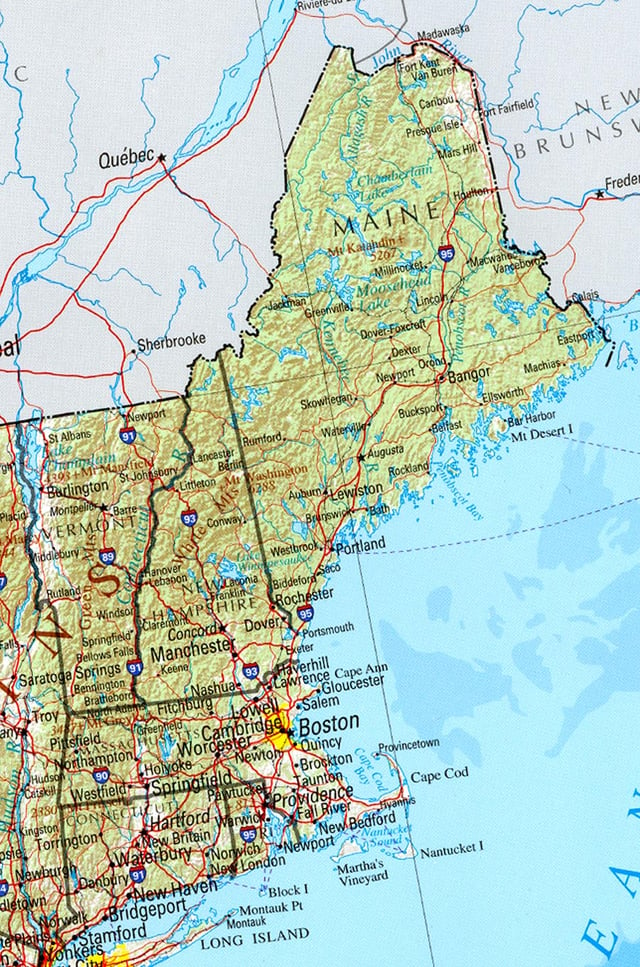 A political and geographical map of New England shows the coastal plains in the southeast, and hills, mountains and valleys in the west and the north.