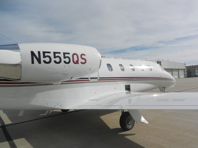 NetJets aircraft all wear this paint scheme, and those based in the US have the letters "QS" painted on the tail number signifying Quarter Share.