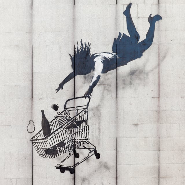 Shop Until You Drop in Mayfair, London. Banksy has said "We can't do anything to change the world until capitalism crumbles. In the meantime we should all go shopping to console ourselves."