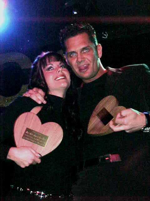 Nacho Vidal and Jewel De'Nyle holding their XRCO Award trophies for Best Male-Female Sex Scene in 2001