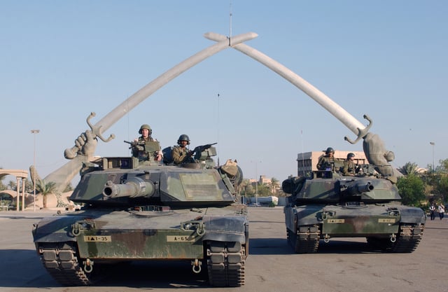 U.S. soldiers at the Hands of Victory monument in Baghdad