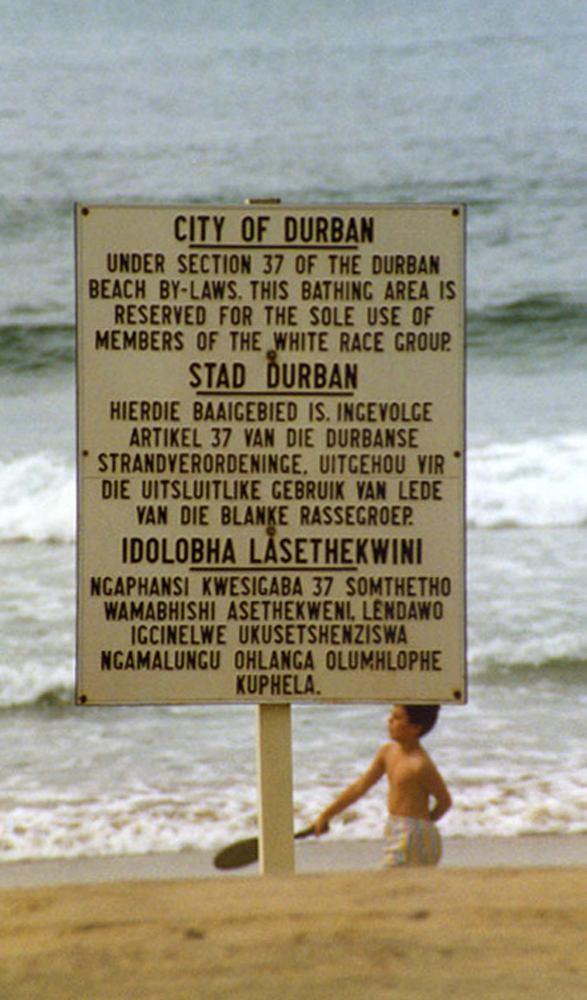 Sign reserving a Natal beach "for the sole use of members of the white race group", in English, Afrikaans, and Zulu