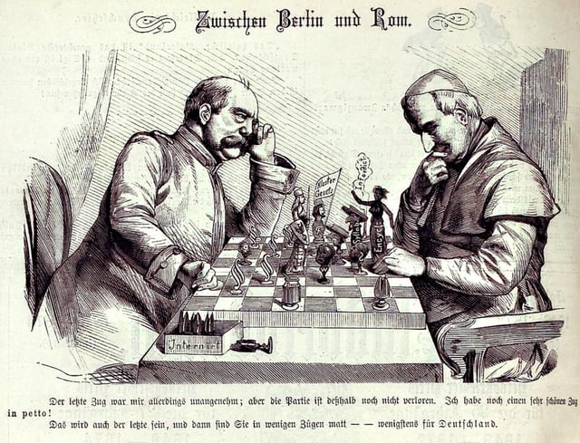 Tensions between Germany and the Catholic Church hierarchy are depicted in a chess game between Bismarck and Pope Pius IX.Between Berlin and Rome, Kladderadatsch, 1875.