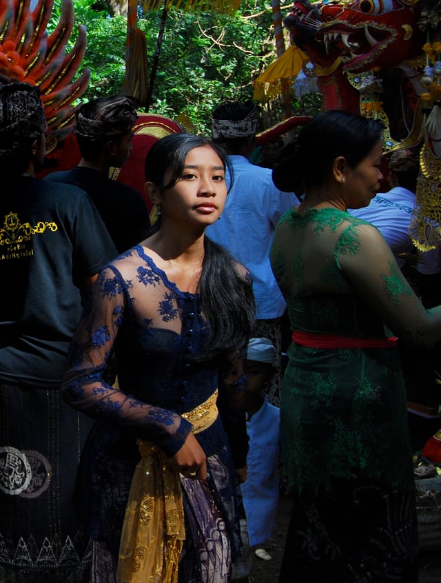 A Native Indonesian Balinese girl wearing kebaya during a traditional ceremony.