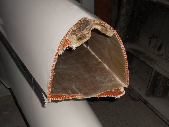 A damaged 8+, showing cross section near the bows and the skin construction.
