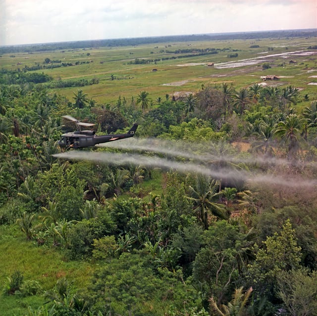 U.S. helicopter spraying chemical defoliants in the Mekong Delta, South Vietnam, 1969