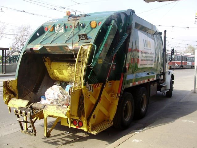 A Waste Management trash collection truck in Toronto, Ontario.