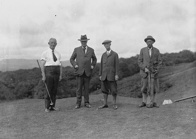 Four gentlemen golfers on the tee of a golf course, 1930s