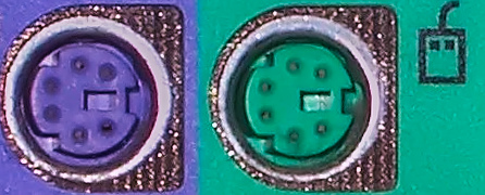 Color-coded PS/2 connection ports; purple for keyboard and green for mouse