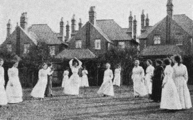 Women in England playing netball on a grass court, 1910