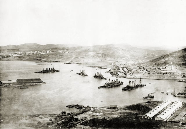 Port Arthur viewed from the Top of Gold Hill, after capitulation in 1905. From left wrecks of Russian battleships: Peresvet, Poltava, Retvizan, Pobeda and the cruiser Pallada.