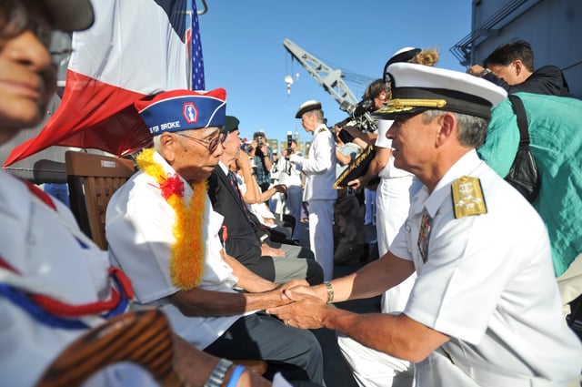 Pearl Harbor (July 2, 2014). Adm. Harry Harris Jr., commander of the U.S. Pacific Fleet, thanks Ralph Tomei, a 442nd Regimental Combat Team veteran, for his contributions during World War II. Tomei represented his friend Shiro Aoki as Rear Adm. Anne Cullere, commander in chief of French forces in the Pacific, presented him with the French Nation Order of the Legion of Honor aboard the French Floréal-class frigate FS Prairial. For more than a decade the government of France has presented the Legion of Honor to U.S. veterans who participated in the liberation of France during World War II.