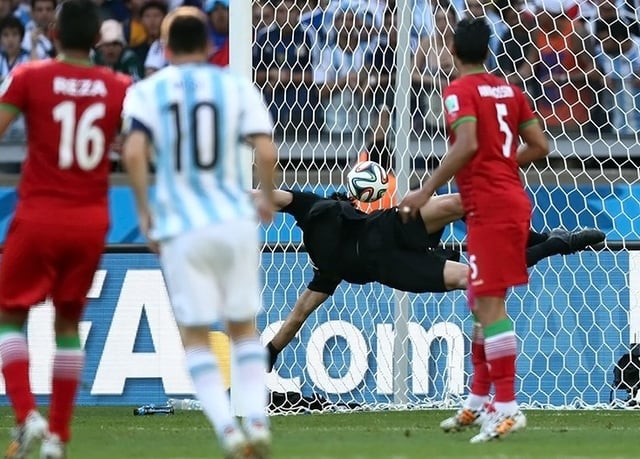 Messi watches his 25-yard curling strike hit the net against Iran to win the game for Argentina in their second group game at the 2014 FIFA World Cup