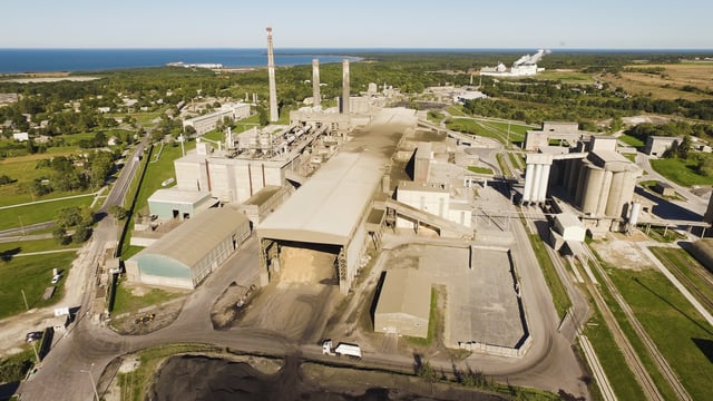 A factory, a traditional symbol of the industrial development (a cement factory in Kunda, Estonia)