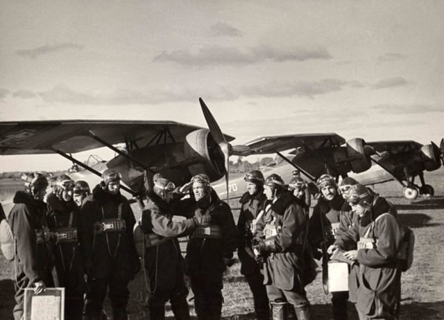Lithuanian Air Force pilots with their ANBO 41 in Linksmadvaris aerodrome