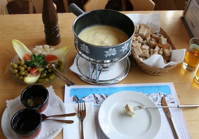 Fondue is melted cheese, into which bread is dipped