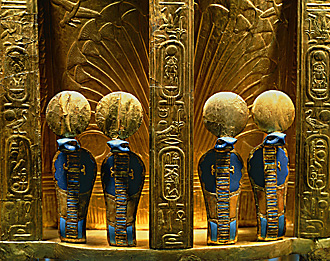 The reverse side of the throne of Pharaoh Tutankhamun with four golden uraeus cobra figures. Gold with lapis lazuli; Valley of the Kings, Thebes (1347–37 BCE).