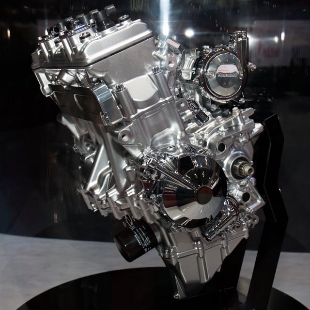 Engine shown at 2013 Tokyo Motor Show, supercharger has cover embossed "Kawasaki" to right of cylinders