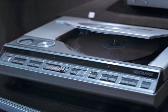 A top-loading, Magnavox-brand LaserDisc player with the lid open.