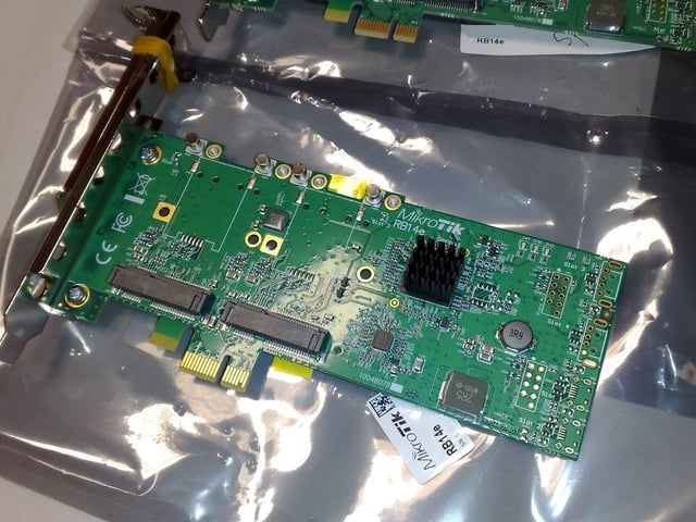 A PCI Express ×1 card containing a PCI Express switch (covered by a small heat sink), which creates multiple endpoints out of one endpoint and allows it to be shared by multiple devices