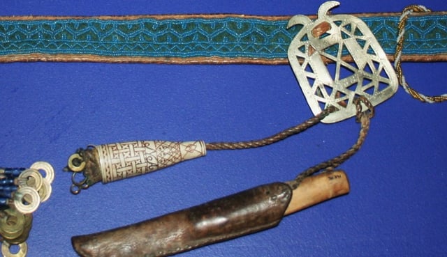 Beaded belt, knife, and antler needlecase