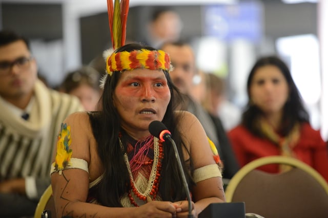 Huaorani man with the typical Amazonian indigenous clothes