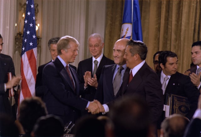 US President Jimmy Carter shakes hands with General Omar Torrijos after signing the Panama Canal Treaties (September 7, 1977).