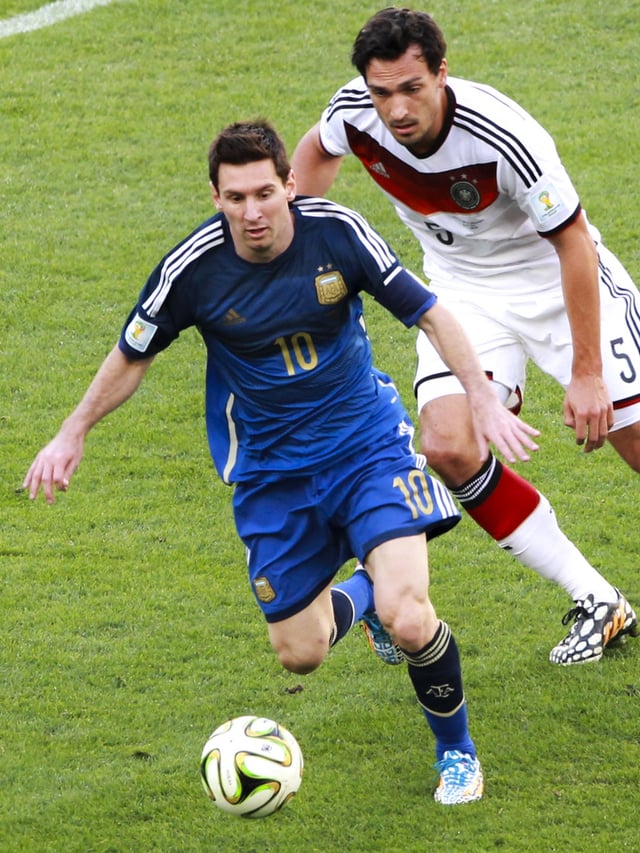 Messi battles Germany's Mats Hummels for the ball during the final of the 2014 FIFA World Cup.
