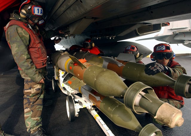 Aviation Ordnancemen loading GBU-12 bombs in 2005