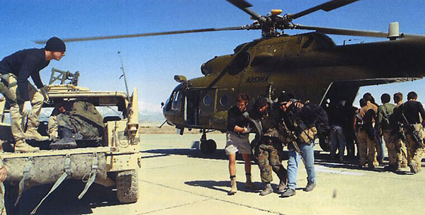 US Special Forces help Northern Alliance troops away from a CIA-operated MI-17 Hip helicopter at Bagram Airbase, 2002